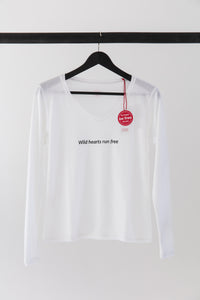 premium quality slogan t-shirt white saying: Wild Hearts Run Free