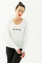 Load image into Gallery viewer, woman wears a premium quality slogan t-shirt white saying: Never Compromise