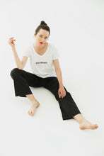 Load image into Gallery viewer, woman wears a premium quality slogan t-shirt white saying: Never Compromise